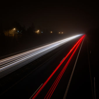 Car lights on the night highway