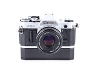 Canon AE-1 + Canon 50 mm 1,8 FD bazar + Power Winder bazar
